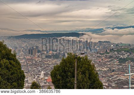 Quito, Ecuador - December 2, 2008: Seen From Cerro El Panecillo Down. Wide Cityscape With Towers And