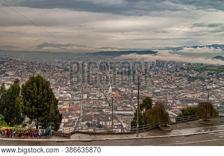Quito, Ecuador - December 2, 2008: Seen From Cerro El Panecillo Down. Wide Cityscape With Towers And