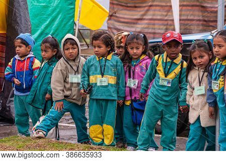 Quito, Ecuador - December 2, 2008: Cerro El Panecillo. Small Row Of Primary School Children Clothed 