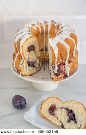 Typical German Poppy Seed Plum Gugelhupf Cake On A Table