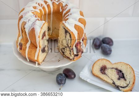 Typical German Poppy Seed Plum Gugelhupf Cake On A Table
