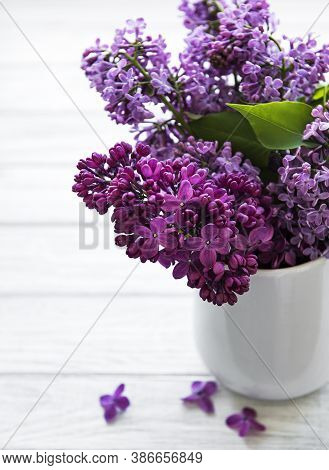Spring Bouquet. Luilac Flowers In A Vase On A White Woodwn Table