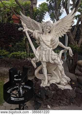 Denpasar, Indonesia - September 28, 2019: Angel Statue On The Park Of Holy Spirit Cathedral.