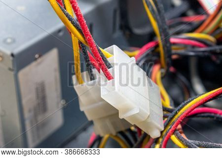Molex Wires In Dust In Computer System Unit Close-up Plug. High Quality Photo