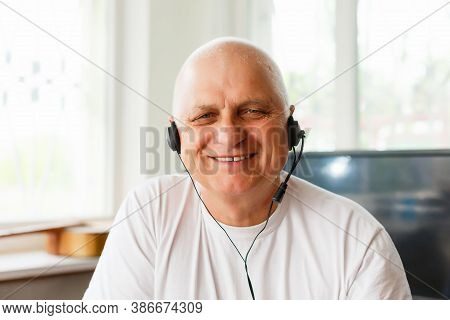 Head Shot Close Up Happy Grandfather Looking At Camera, Talking To Grown Up Children Or Communicatin