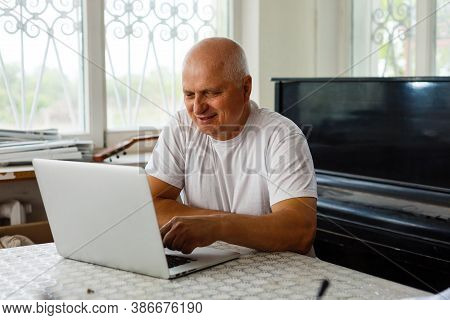 Elderly Man With Headphones And Computer Laughing Happily, Telework, E-business Or Commerce, Custome