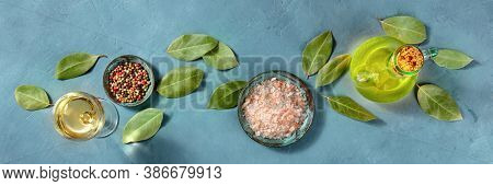 Cooking Panorama. A Flat Lay With Salt, Pepper, Bay Leaves, Olive Oil, And White Wine, Overhead Shot