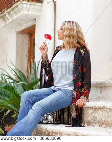 Bohemian Fashion Young Women With Red Flower Wearing Fringed Kimono