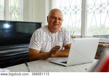 Elderly Man With Headphones And Computer Laughing Happily, Telework, E-business Or Commerce, Custome