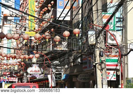 Manila, Philippines - November 25, 2017: Messy Cables And Chaotic Wires Street View In Binondo Distr