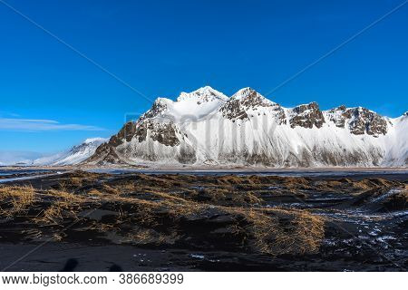 Aerial Winter Landscape View Of Vestrahorn And Black Sand Beach On The Stokksnes Peninsula In Southe