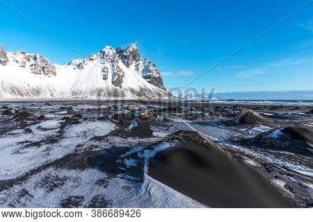 Aerial Winter Landscape View Of Vestrahorn And Black Sand Beach On The Stokksnes Peninsula In Southe