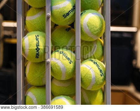 Paris, France - April 13, 2028: Samsonite Tennis Balls Arranged In Steel Support