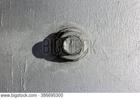 Large Head Bolt On Metal Construction As Background - Engineering Concept. Metal Head Of Bolt Mounte