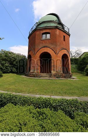 Old Astronomy Observatory Building Of Red Bricks With Green Cupola