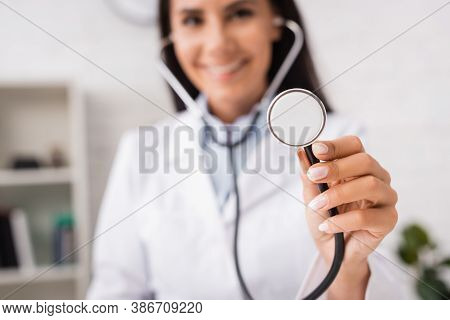 Selective Focus Of Joyful Doctor Holding Stethoscope In Hospital