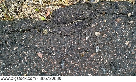 Broken Asphalt. Horizontal Abstract Closeup. Crack Pavement. Smoky Bitumen Street. Black Industrial 