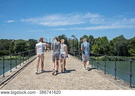 Avignon, France - July 7, 2020: Tourists Visiting The Famous Medieval Bridge Benezet In Avignon