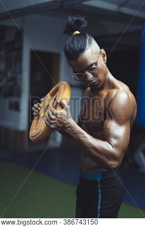 Young Shredded And Fit Boy Working Out In The Gym