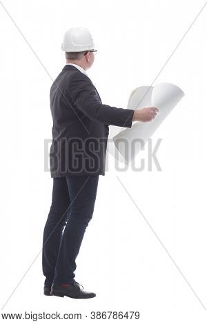 side view. experienced architect carefully reading the new drawi