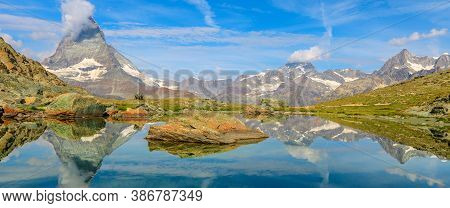 Banner Panorama Reflection Of Mount Matterhorn And Swiss Alps On Riffelsee Lake In Zermatt, Valais, 