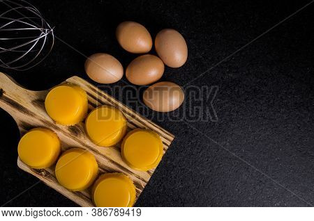 Delicious Quindins On Wooden Board, Traditional Brazilian Dessert Made With Egg Yolk, Sugar And Coco