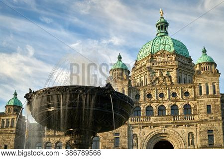 Parliament Building And Fountain Victoria British Columbia. A Fountain In Front Of The Parliament Bu