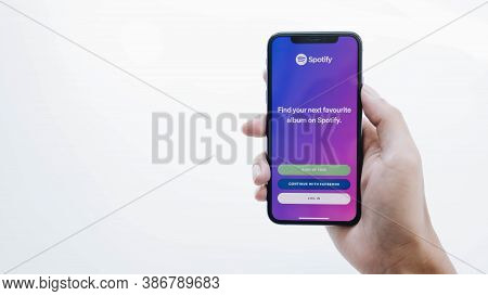 Chiang Mai, Thailand - Jul 17 2020: Person Holding A Brand New Apple Iphone Xs With Spotify Logo On