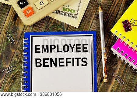 Employee Benefits - Text Inscription In The Planning Form On The Background Of Office Supplies. Bene