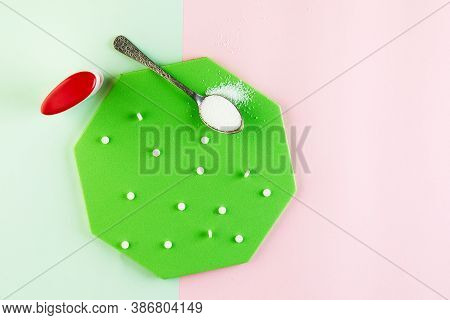 Sugar Substitute Tablets And Natural Sweetener Powder On A Green Podium. Flat Lay. Copy Space For Te