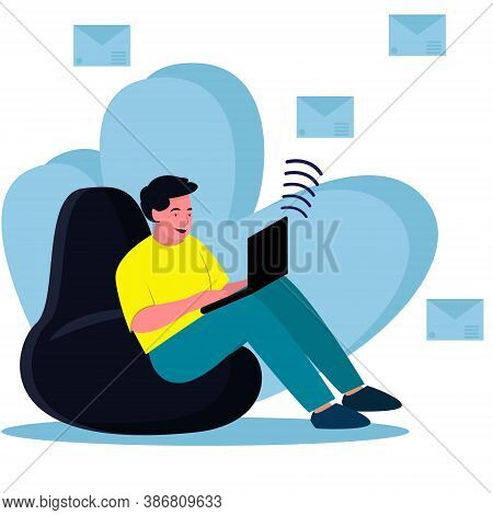 A Male Freelancer Works At Home On A Laptop