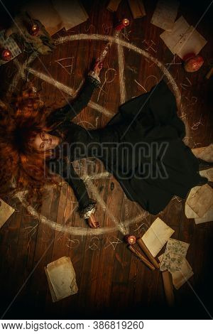 A portrait of a scary witch in the wooden house. Magic, dark force, spell. 