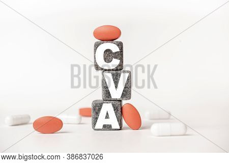 A Group Of White And Red Pills And Cubes With The Word Cva Cerebrovascular Accident Stroke. On Them,