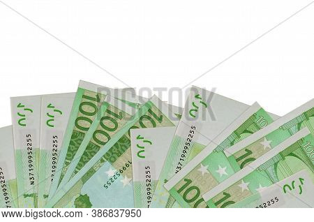100 Euro Bills Lies On Bottom Side Of Screen Isolated On White Background With Copy Space. Backgroun