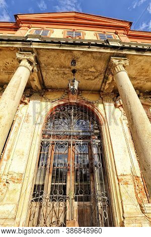 Detail Of The Entry Door Of The Abandoned Castle With Ornamental Bars And Columns