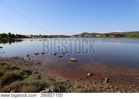 Reflection Early In The Morning On A Salt Lake In Croatia