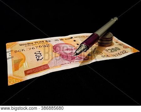 Indian Currency Two Hundred 200 Rupees Note Isolated On Black Background For Financial Marketing Pur