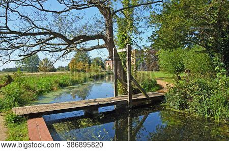 Tiny Wooden Foot Bridge Stream And Trees.