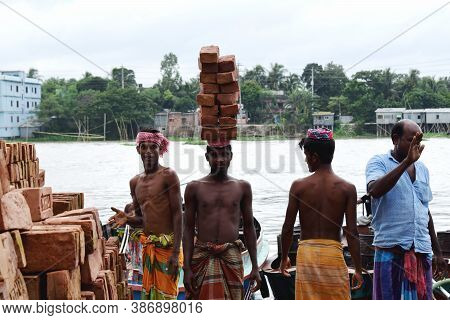 Construction Laborer Stocking Brick Near River Side,the Photo Was Taken From Shitolokkha River, Nara