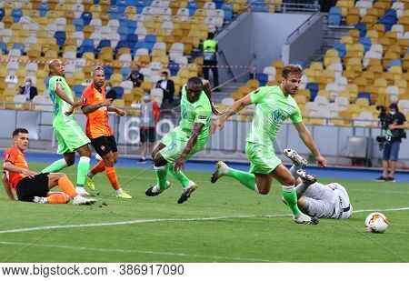 Kyiv, Ukraine - August 5, 2020: Vfl Wolfsburg Players (in Green) Defend Their Net During The Uefa Eu