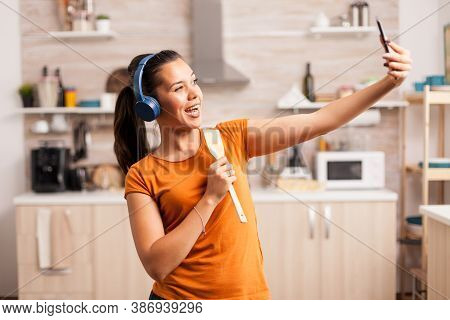 Taking A Selfie And Singing In The Morning Using Wooden Spoon. Energetic, Positive, Happy, Funny And