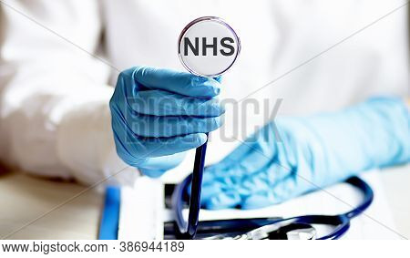 Female Hand Holding Stethoscope With Text Nhs Health Concept