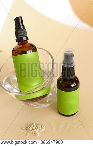 Close Up Glass Spray Bottle Wirth Cosmetic Product And Green Space For Brand Near Leaf.