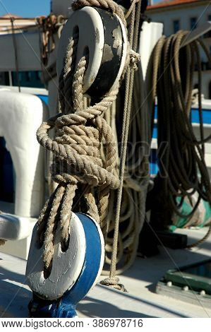 Tall Ship Detail. Ropes And Wooden Pulleys