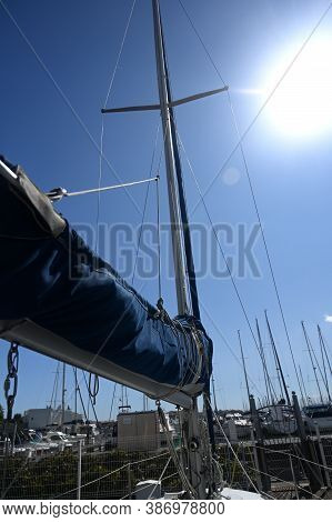 Low Angle View Of Boom And Mast Against Sky