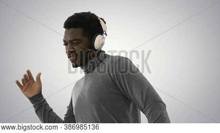 Passionate African American Man Listening To The Music In Headph
