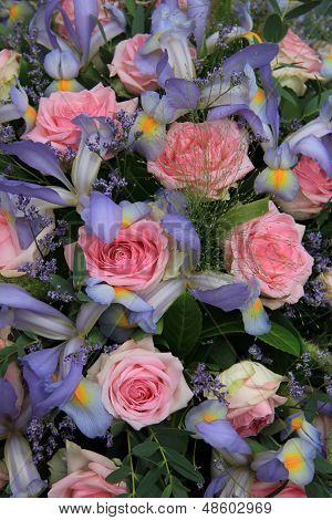 Blue Irises And Pink Roses In Bridal Arrangement