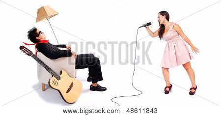 A Female Singer And A Male Guitarrist In Action
