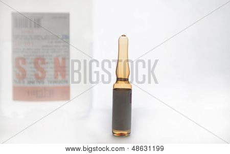 Brown Ampule On Normal Saline Background Show Injection Concept