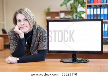 Calm Attractive Woman Sitting Near To Blank White Screeen